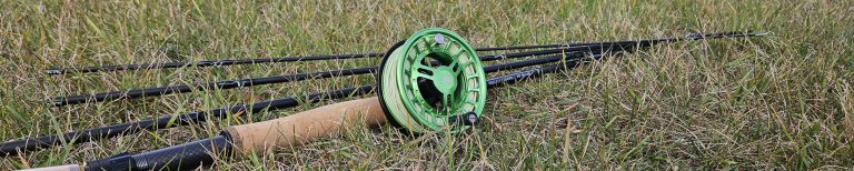Reel Fly Fishers 6-weight versatile fly rod and chrono fly reel lying on grass
